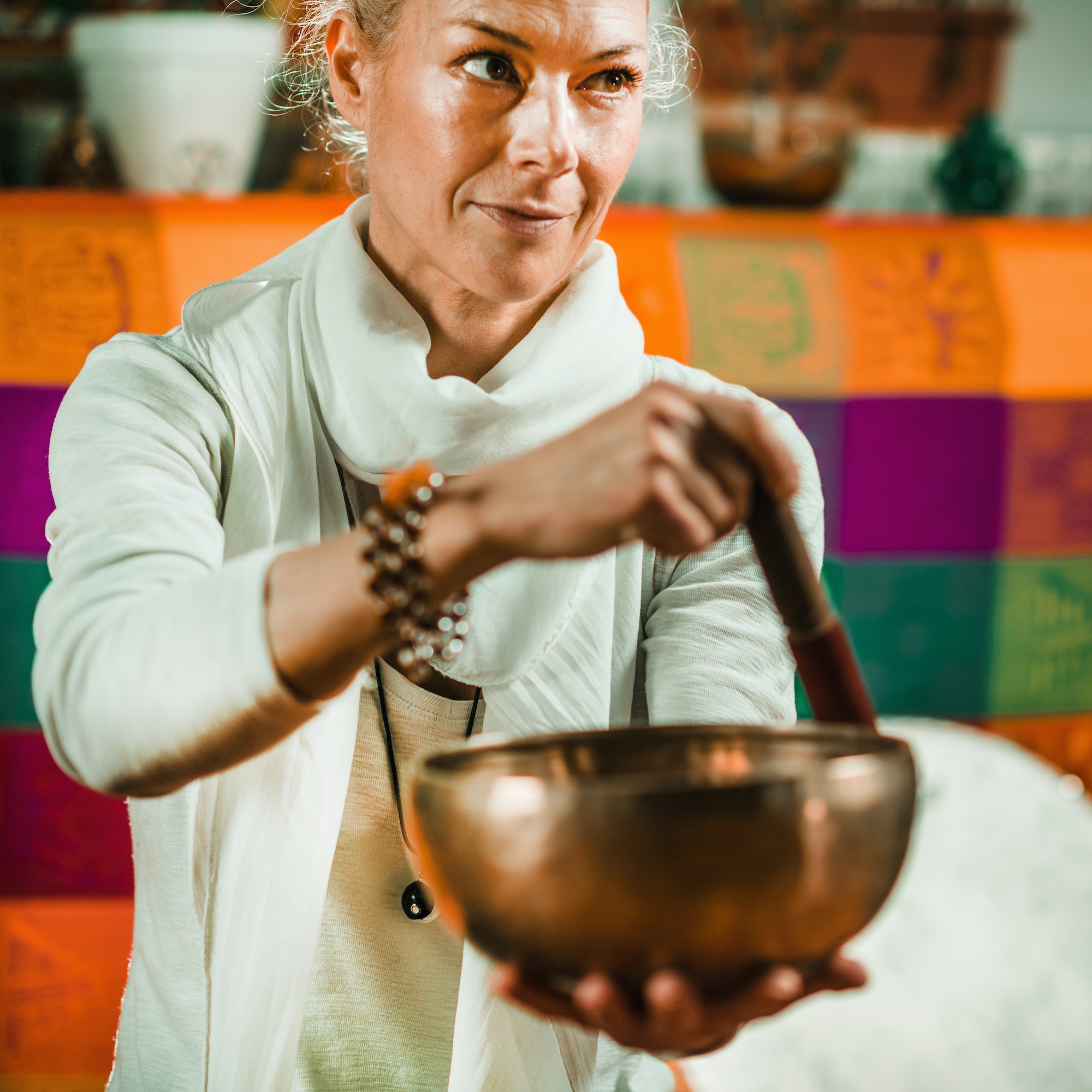 Woman using tibetan singing bowls - Melanie Holden Psychic Energy Healer, Physical Therapist, and Reiki Master Teacher